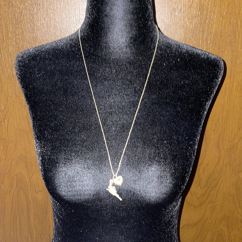 Silver gun and heart necklace